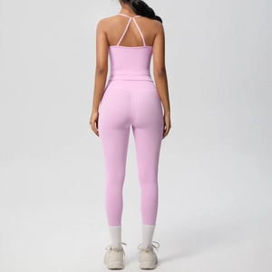 Rear view of pink yoga set featuring cross-strap tank top and high-waist leggings