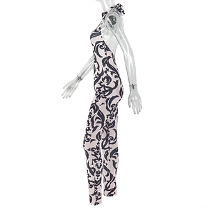 Detail view of Baroque black and white print jumpsuit with halter neck and open back