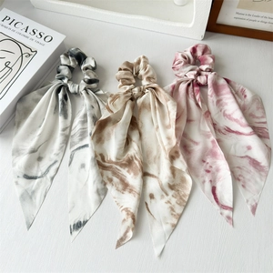 Three-piece set of marble print chiffon hair scrunchies with long streamers in grey, brown, and pink