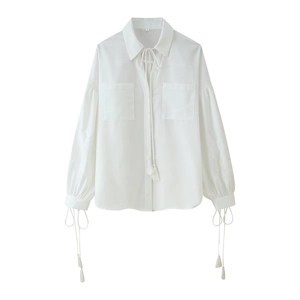 White linen blend shirt with bohemian tassel ties and lantern sleeves with embroidery