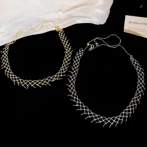 Minimalist gold and silver woven hollow necklaces with adjustable ball chain on white silk