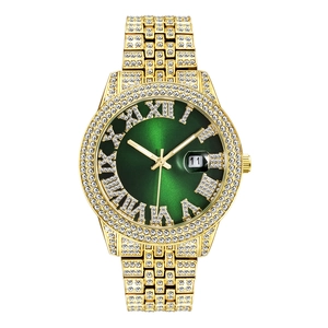 Macro detail of luxury gold watch featuring green Roman dial and diamond bezel