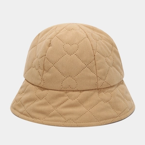 Close-up of khaki corduroy bucket hat featuring stitched heart-shaped quilted patterns