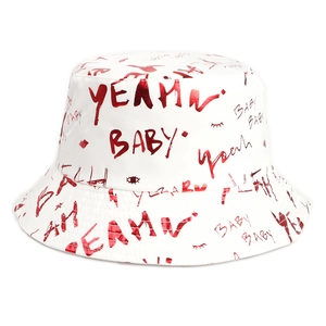 Detail of white cotton bucket hat featuring red graffiti text like BABY and YEAH