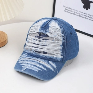 Distressed blue denim baseball cap with letter print and vintage ripped details