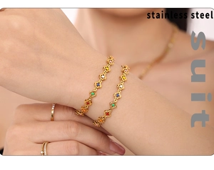Detailed view of colorful enamel flower bracelet in gold-plated stainless steel jewelry set