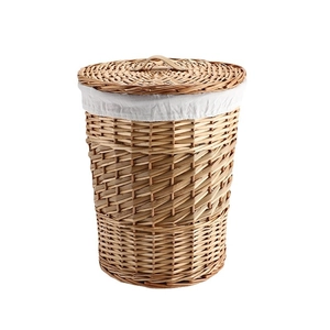 Handwoven natural wicker laundry hamper with leather handle and white cotton liner