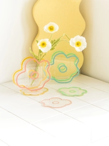 Nordic flower acrylic coaster and vase in pink and orange on a cream lifestyle backdrop