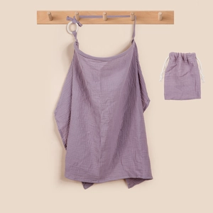 Purple muslin nursing cover and drawstring storage bag set on a wooden wall hook