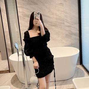 Chic black mini dress with puff sleeves and silver rhinestone ball clutch bag