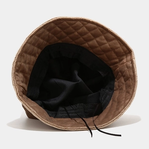 Brown quilted bucket hat for women with diamond stitch pattern and adjustable lining
