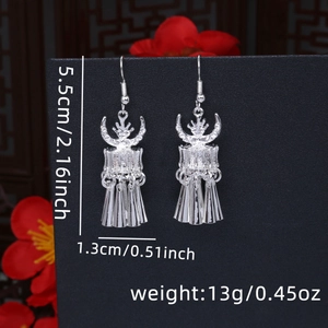 Detail view of ethnic silver drop earrings with dimensions and weight measurements