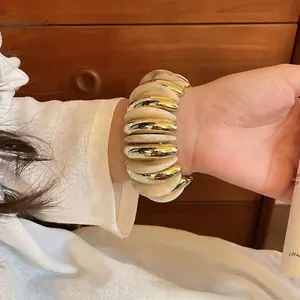Minimalist acrylic round elastic bracelet in cream and gold for casual wear