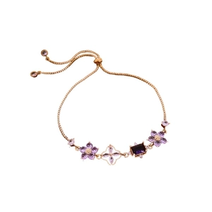 Rose gold adjustable zirconia flower bracelet with purple crystals and petal design