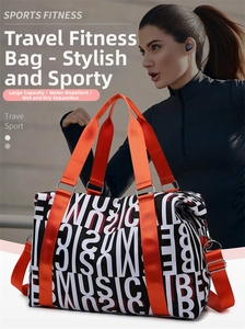 Large fitness travel bag with MUSIC print and orange handles worn by female model