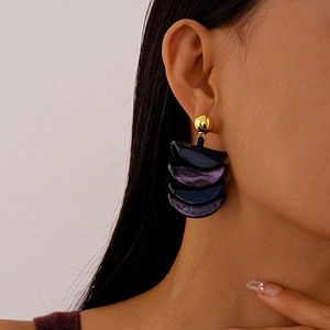 Retro iridescent resin geometric drop earrings with gold studs on female model