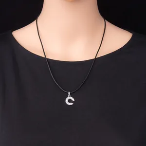 Silver letter C pendant necklace with sparkling rhinestones on a black wax cord