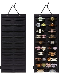 Hanging black felt organizer showing multiple claw clips and wall storage capacity