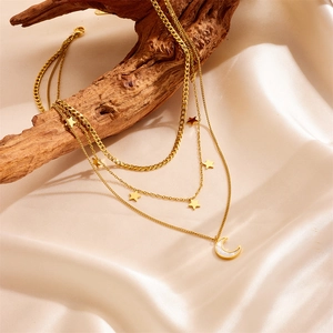 Three-layer gold star and moon necklace with white shell inlay on champagne silk