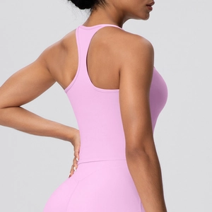 Detail of pink-purple racerback yoga tank top showing the elastic athletic fabric