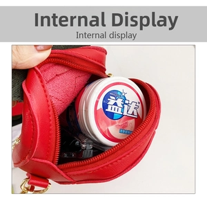 Macro view showing red leather bag interior with zipper and compact storage space