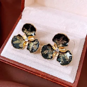 Boucles d'oreilles vintage fleurs en émail noir avec poussière d'or et zircon