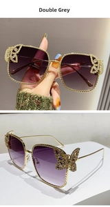 Detailed view of luxury butterfly hinge with crystals on golden metal sunglasses