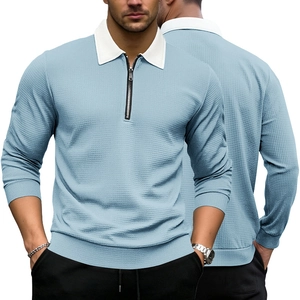 Detail of light blue waffle knit fabric and white zipper collar on men's long sleeve polo