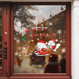 Christmas reindeer window stickers with Merry Christmas text and cartoon dogs on glass