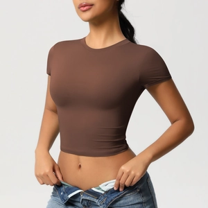 Close-up of brown slim-fit crop top yoga shirt with a round neck and short sleeves