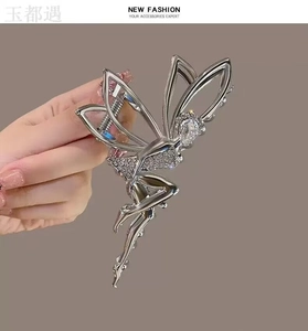 Macro view of silver angel hair claw clip featuring sparkling rhinestones and a pear-cut diamond