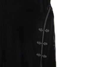 Detailed close-up of traditional Chinese knots on black velvet cheongsam dress