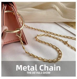 Detail of pink jelly bag showing gold metal chain strap and luxury lobster clasp