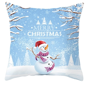 Detail of Christmas snowman print on blue cushion cover with Merry Christmas text