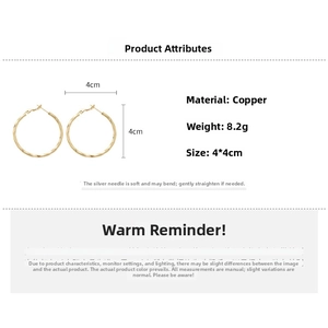 Detail view of 14k gold plated twisted hoop earrings with 4cm size and 8.2g weight specs