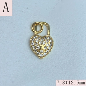 Detailed macro view of heart lock pendant with zircon inlays and star pattern 7.8x12.5mm