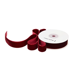 Deep burgundy velvet ribbon roll for Christmas gift wrapping and floral bouquet decoration