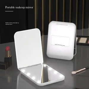 Portable LED makeup mirror in white with 8 light beads and a foldable pocket design