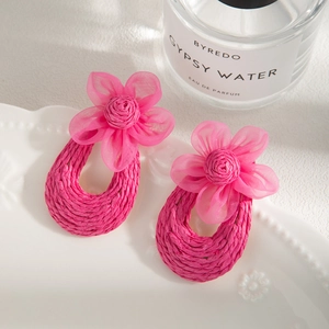 Handmade woven raffia hoop earrings with rose pink chiffon floral details for summer