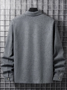 Detail of grey corduroy jacket back view with button cuffs on industrial grid