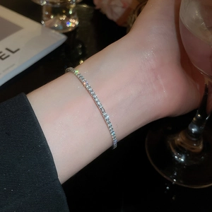Close-up of elegant silver tennis bracelet with brilliant pavé set round crystals
