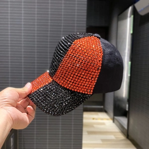 Handcrafted luxury rhinestone baseball cap in black and orange sparkling crystals