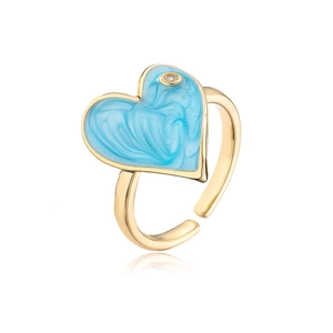 Macro detail of 18K gold plated heart ring with light blue enamel and zircon inlay