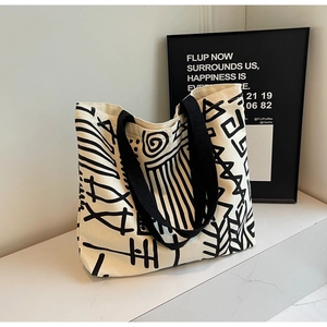 Artistic graffiti canvas tote bag with abstract black lines for modern daily commuting