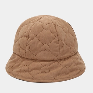 Close-up of heart-shaped quilted pattern on camel corduroy bucket hat for autumn and winter