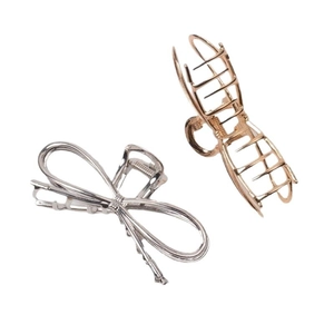 Elegant silver and rose gold metal bow hair clips in geometric shark clip style for women