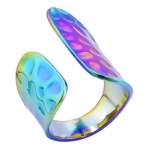 Detailed macro view of rainbow plated stainless steel open ring with hammer texture finish