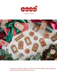 Close-up of festive Christmas gift tags on white fabric with red ribbons and pine cones