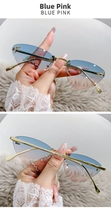 Detail of rimless cat eye sunglasses with blue-pink gradient lenses and crystal F logo