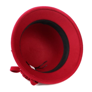 Inside view of red wool felt hat showing black sweatband and adjustable drawstring strap